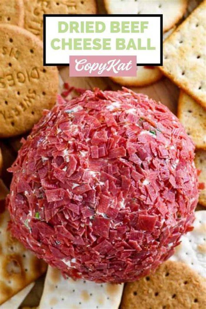 Cheese ball covered in dried cherries, pecans and parsley.